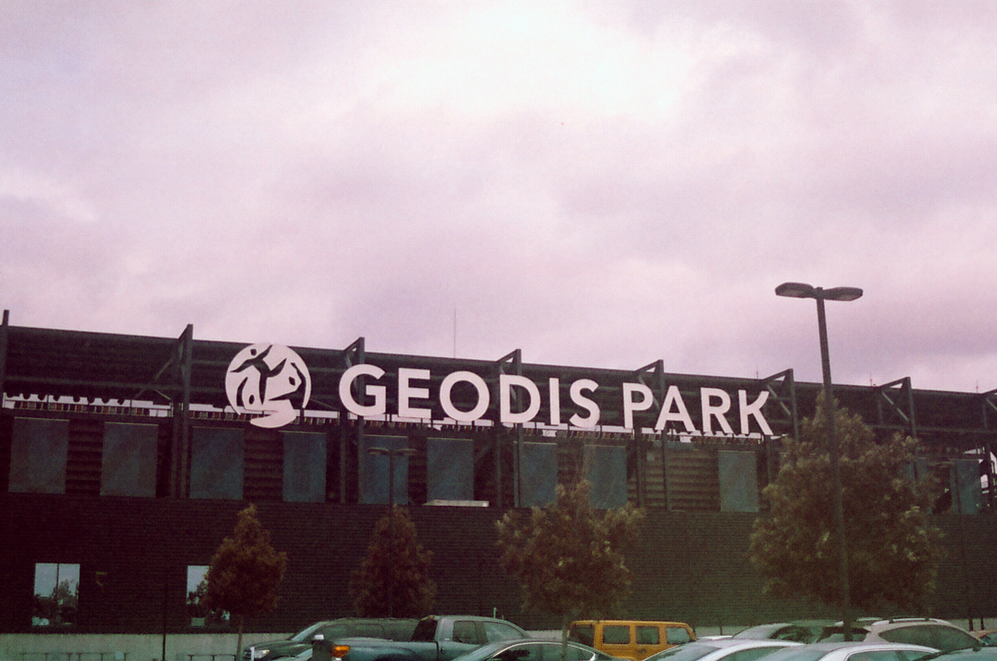 Photo of a stadium wall with a large sign reading "GEODIS PARK"