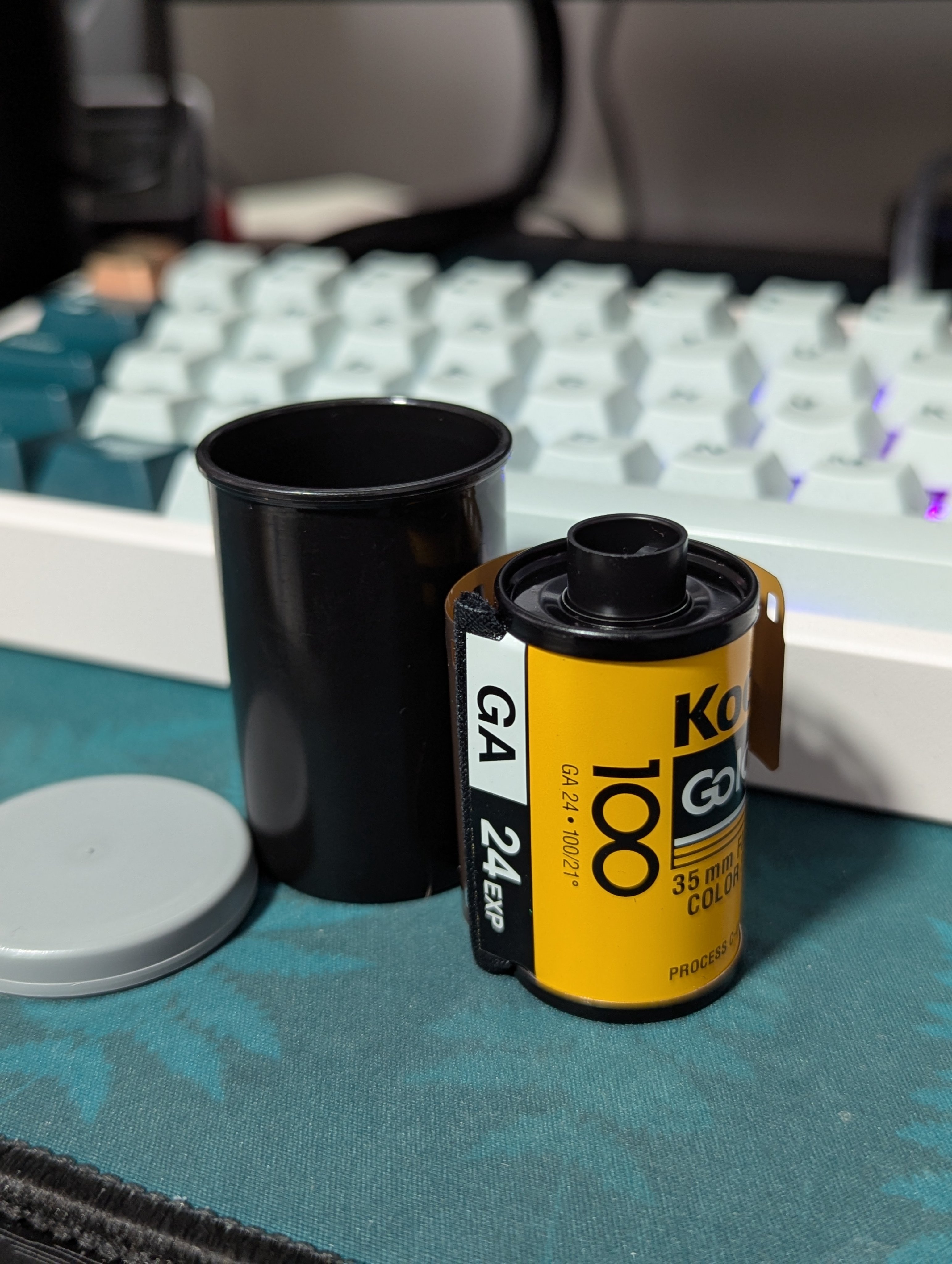 Photo of a roll of Kodak Gold Plus 100 35mm film