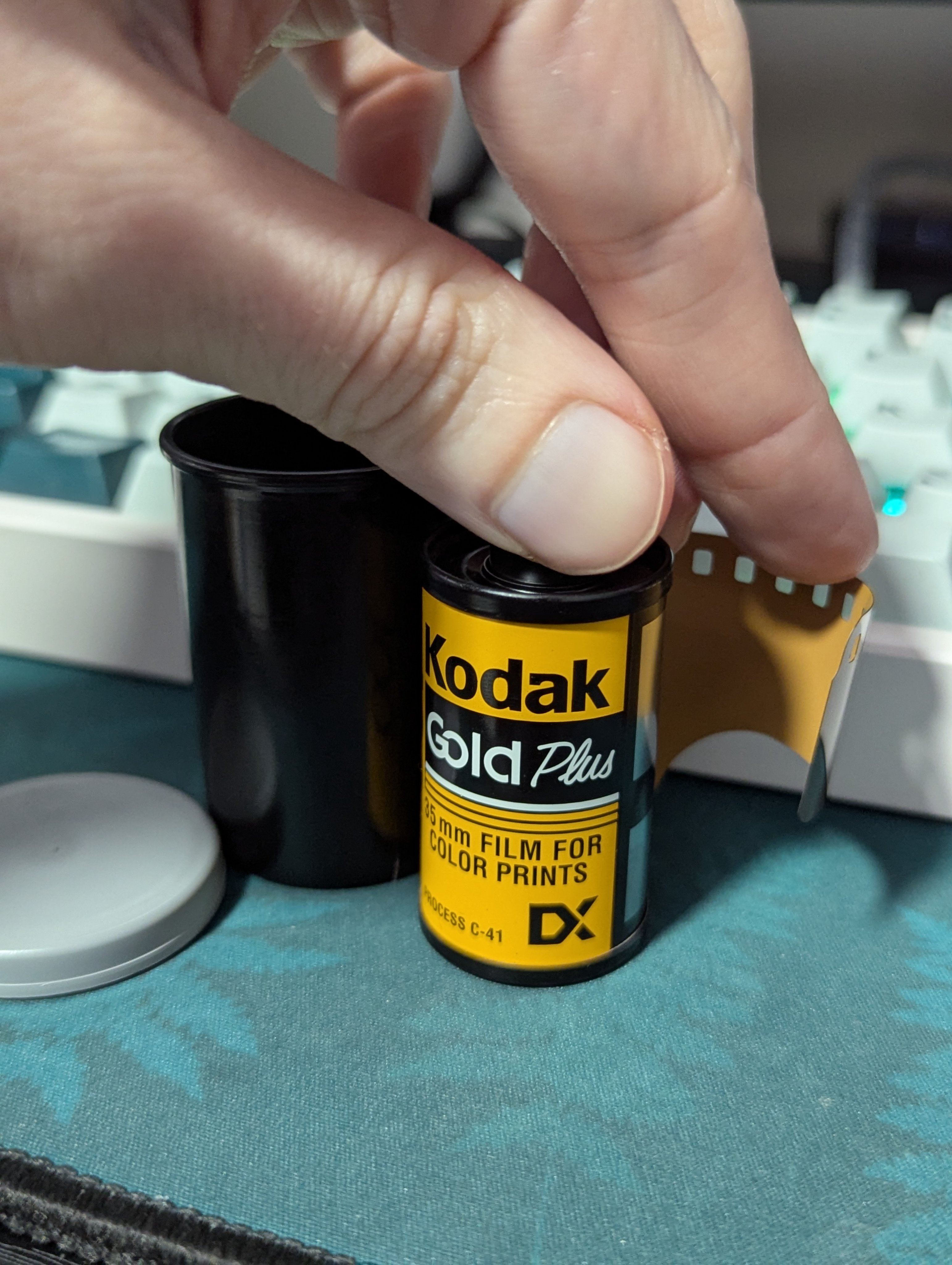 Photo of a roll of Kodak Gold Plus 100 35mm film